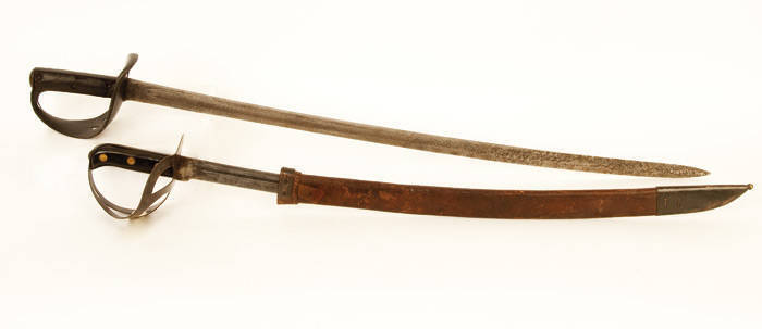 German Cavalry cutlass 19th century by Kirschbaum & Co. Solingen, painted guard, blade pitted, 100cm rustic condition; Cutlass with leather scabbard, 20th century. 77cm, Good condition.