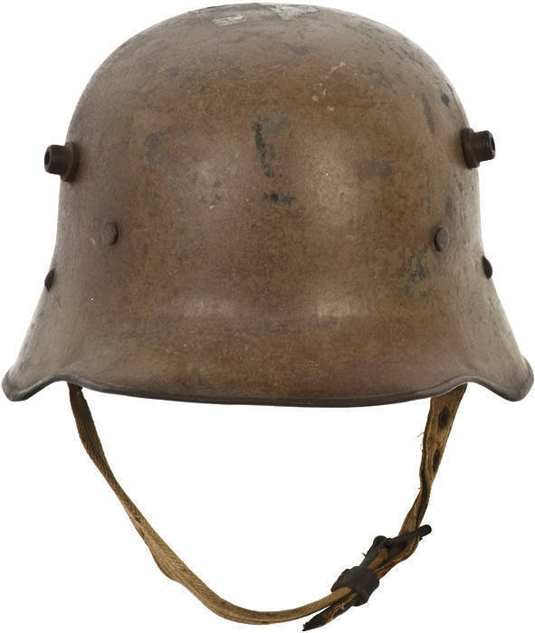 WW1 Austrian M17 "STAHLHELM" (steel helmet) with original brown/green paint & patina. This example was probably souvenired by an American soldier as it still retains U.S. postage stamps on top. VG condition.