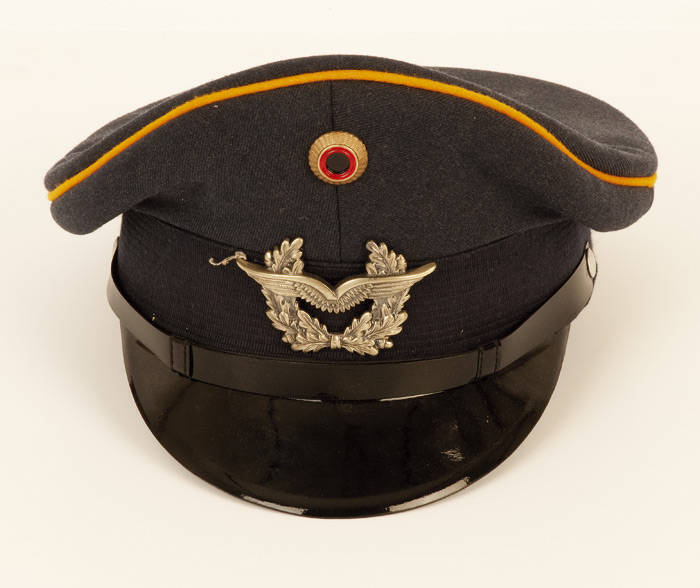 MILITARY HATS: Turkish cotton cap WWI style (with red and white demilune epaulettes); Royal Hospital Chelsea peaked cap; French National Police; German visors (2); Disabled American veterans soft cap and blue military visor. VG condition.