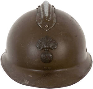 FRENCH HELMET: First World War infantry M15 Adrian helmet. The Adrian helmet was the first French combat helmet and the first modern steel trench warfare helmet, good condition; Army boots (2) pairs, G condition.