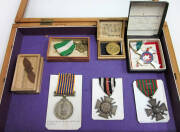 MILITARIA: Ensigns and flag, framed accoutrements, A.I.F. soup tureen, German gas mask, awarded silver plated tray, foot lockers (2), ephemera. Inspection will reward. - 2