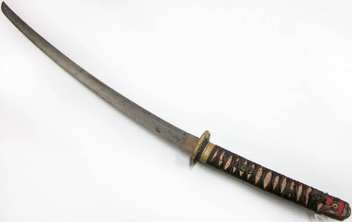 JAPANESE SHORT SWORD: Old blade with signed Tang, Edo period Tsubu with remains of gold inlay, scabbard old but painted over original lacquer. 64cm. Fair condition