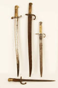 BAYONETS: Three antique French bayonets (one with scabbard); 19th century German bayonet with brass handle, good condition