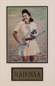 MADONNA, signature on colour photograph from "A League of Their Own", window mounted, framed & glazed, overall 32x46cm. With CoA.