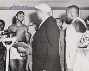 MUHAMMAD ALI, signed b/w photograph of Ali at weigh-in with Sonny Liston, size 51x41cm. With CoA sticker No.0600.