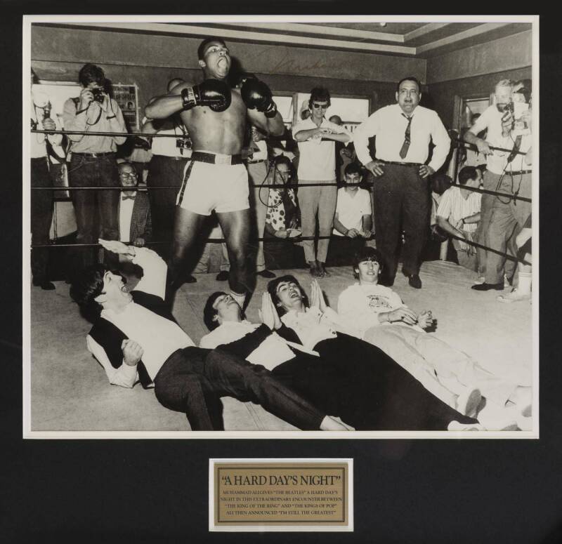 MUHAMMAD ALI & THE BEATLES, display "A Hard Day's Night" with photograph of Ali standing over The Beatles, signed in gold pen "Muhammad Ali", window mounted, framed & glazed, overall 66x64cm. With CoA.