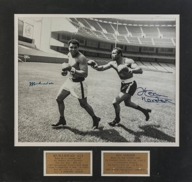 MUHAMMAD ALI v KEN NORTON, photograph signed by both fighters, window mounted, framed & glazed, overall 67x63cm. With CoA.