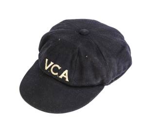 LEN MADDOCKS' VICTORIAN CRICKET CAP, baggy blue with "V.C.A." embroidered on front, named inside "L.Maddocks". [Len Maddocks played 7 Tests 1954-56, and fplayed for Victoria 1946-62 & Tasmania 1963-68].