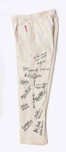 1990 RICHARD HADLEE TESTIMONIAL - New Zealand XI v World XI: Cricket trousers signed & endorsed by World team with 11 signatures including Sunil Gavaskar, Kapil Dev, Allan Border & Michael Holding.