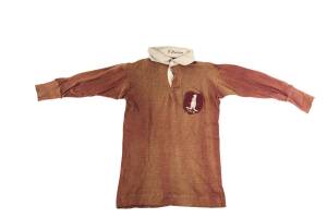 1919 AUSTRALIA RUGBY LEAGUE JERSEY, from the first Australian tour to New Zealand, brown colour with "(Kangaroo)/ 1919" badge on breast, signed inside collar by Kiwis captain Karl Ifwersen. Few small holes, generally VG condition.  [Karl Ifwesen represent