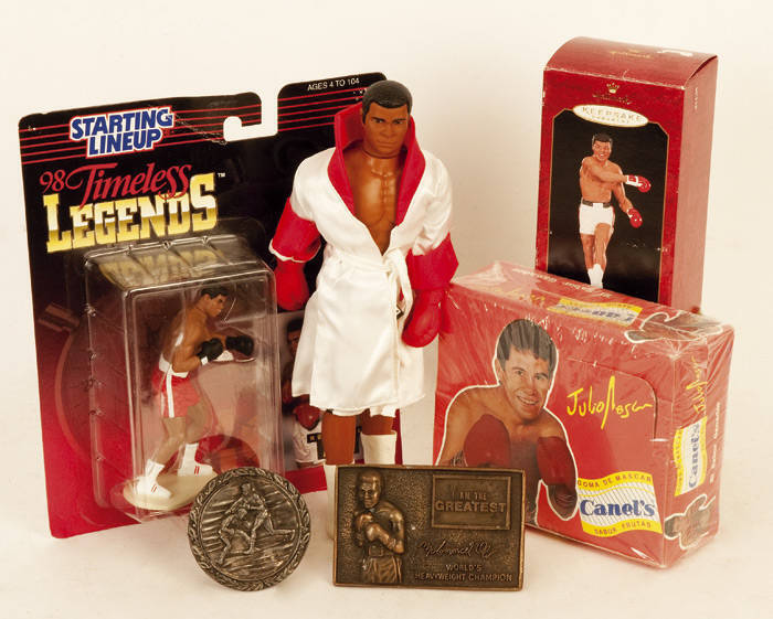 BOXING COLLECTABLES, noted "Timeless Legends" figurines with cards (4); Muhammad Ali figurines (2); box of candy featuring Julio Cesar Chavez; belt buckles (3); key rings (8).