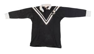 TOM HADFIELD'S NEW ZEALAND "KIWIS" JERSEY, black with white "V" and "(kiwi)/  (fern)" badge on left breast, number "2" on reverse. Good match-used condition. [Tom Hadfield played 18 Tests for the Kiwis & 1 for Rest of the World 1956-61, and retired as the