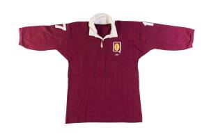 JOHN RIBOT'S 1984 QUEENSLAND RUGBY LEAGUE JERSEY, maroon with embroidered football in Q & "1984" on left breast, with number "17" on reverse, signed on collar "To Jack, J.Ribot". Good match-used condition. [John Ribot played 10 matches for Queensland, 2 m