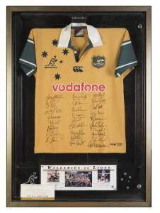 2001 WALLABIES v BRITISH & IRISH LIONS: Wallabies jersey with 27 signatures including Chris Latham, Stephen Larkham & George Gregan, framed & glazed, overall 84x117cm; plus display with photos from the three Tests, framed & glazed, overall 67x85cm; 2001 L