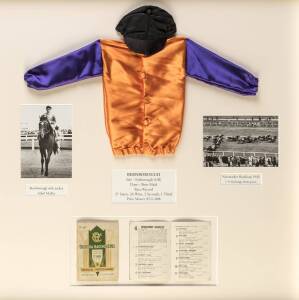 BERNBOROUGH, display comprising racebook for 1946 Newmarket Handicap, window mounted with two photographs & mini-silks & cap, framed & glazed, overall 69x72cm.