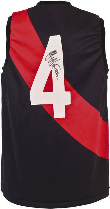 GAVIN WANGANEEN (Essendon/Port Adelaide, winner 1993 Brownlow Medal - first Aboriginal to do so), signature on Essendon football jumper with number "4".