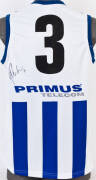 BRADY RAWLINGS (North Melbourne), signature on North Melbourne football jumper with number "3".