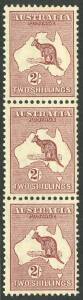 Kangaroos - CofA Wmk - 1935 2/- Maroon (1st Die), vertical strip of 3 with listed varieties "White flaw in Gulf of Carpentaria" and "Flaw on S of AUSTRALIA". Very fresh MUH. BW:40(2)h+j.