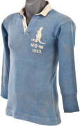 1922 NEW SOUTH WALES RUGBY LEAGUE JERSEY, sky blue wool with embroidered Kangaroo, "N.S.W" & "1922" on left breast, and mark on reverse where number has been removed. Some darning repairs, though good condition for a jersey from this period. {ex Duncan Th