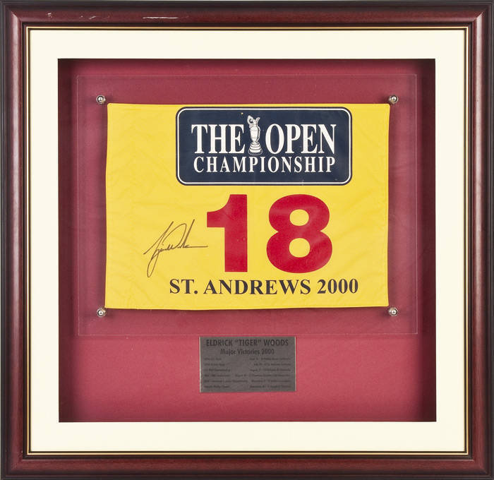 TIGER WOODS, display comprising signature on 18th Hole Flag from 2000 British Open at St.Andrews, window mounted, framed & glazed, overall 80x79cm. With CoA.