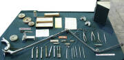 A range of vintage equipment including drill arm, drill bits, forceps, moulds and dental tools, etc.