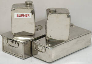 Two small sterilizer trays with lids and associated burners.