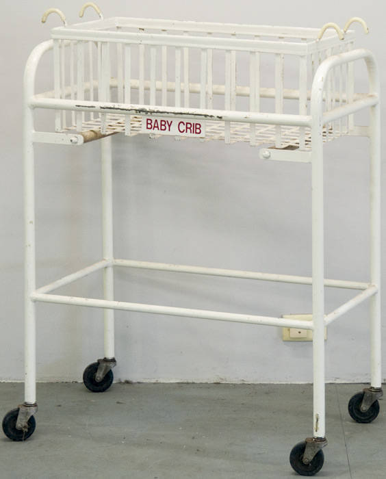 Baby's crib on custom trolley.