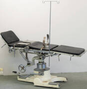 Multi adjustable operating table on wheels by Denyer of Melbourne.