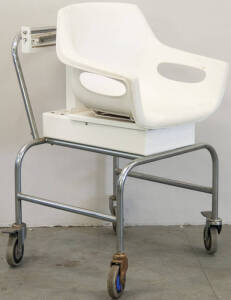 Sit-on scales mounted on 4 wheeled trolley.