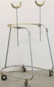 Metal walking frame with underarm supports.
