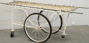 Circa 1920s patient transporting trolley with removeable stretcher.