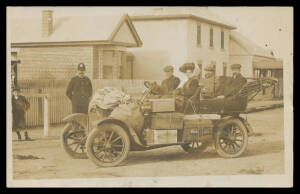 Tasmania - 1910 (c.) real photo of an early automobile laden with parcels, mailbags & passengers under the watchful eye of the local constable, slight bends, used under cover. A terrific card! [The message states "...a tiny glimpse of Sorell & our Mail Mo