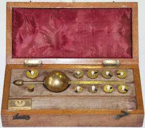 Set of scales in wooden box by Rawleigh.