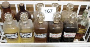 11 glass pharmacy bottles.