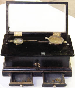 Large dispensary scales in wooden box. Some weights included.