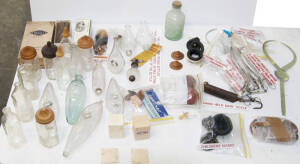 Midwifery and nursery group of items including glass baby feeders, glass baby bottles, wooden nipple shields, glass nipple shields, breast pumps, forceps and umbilical linen thread in original packet. Some items in original boxes.