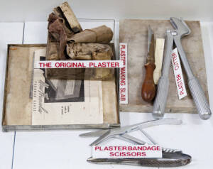 Range of various items relating to bandaging, including plaster cutter and plaster making slab.