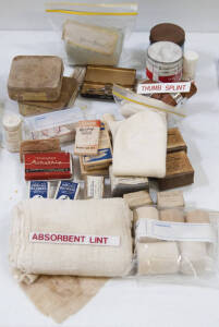 Range of bandages, band aids, lint and a thumb splint. Many items in original packaging.