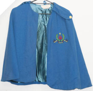 Woollen blue nurses poncho with St.John of God Hospital emblem.