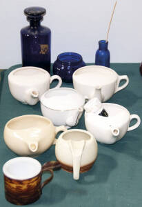 Seven shaving dishes and brush plus 3 blue glass containers.