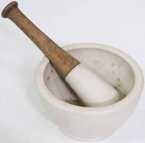 Large stone mortar with stone and wooden pestle