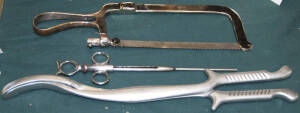 Group of 3 surgical instruments comprising surgical saw, large forceps, tonsil removing instrument.