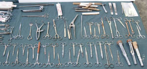 Range of various surgery equipment including forceps (50+ items), bullet & foreign body clamps, Japanese throat trocars, scalpels and more.