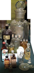 DISPENSING BOTTLES: with painted & printed labels, all with stoppers, in various large sizes - all in very good condition.