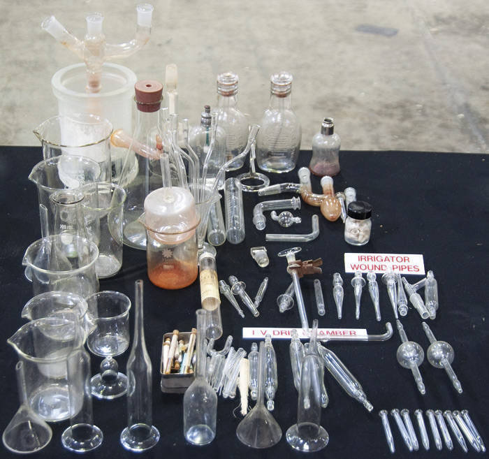 Range of mainly glass items including beakers, irrigation wound pipes, IV drip chambers, etc.