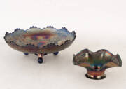CARNIVAL GLASS: "Windmills & flowers" patterned cobalt carnival glass bowl on three feet, 27 x 10cm; Cobalt carnival glass frilled bowl with berries and leaves, 17 x 7cm. VG condition.
