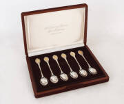 STERLING SILVER spoon set (c1977), "The Sovereign Queens Spoon Collection", by John Pinches [London], "Members edition", with gold plated cameo portraits. Housed in original box and velvet covered case, with certificates. Superb condition.