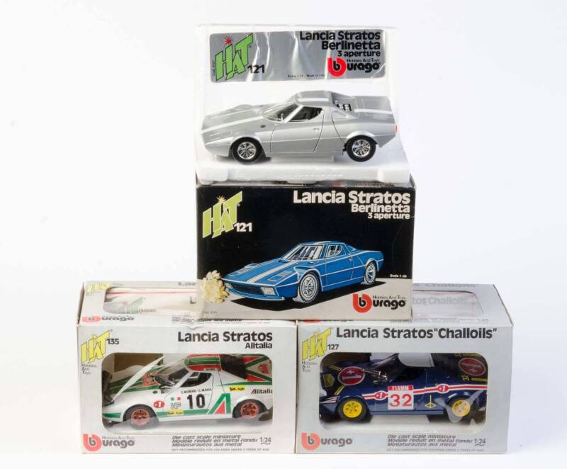 BURAGO: 1:24 Lancia Stratos (135) Alitalia. And, Lancia Stratos (121) Berlinetta 3 Aperture, And, Lancia Stratos 'Challoils' (121). All mint in original cardboard boxes and labels. (3 items)