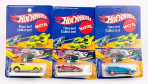 MATTEL: Group of Hot Wheels Die-Cast Metal 1970s Including 'Show-Off' Yellow (6982); And, 'Sand Witch' Red (6974); And, 'Buzz Off' (6976) Most mint condition in original packaging. (3 items)
