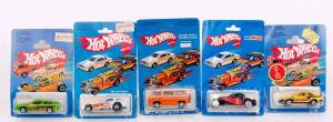 MATTEL: Hot Wheels Group 1970s-80s Including Pontiac J-2000 (3917) Green; And, Sunagon (3251) Orange; And, Firebird Funny Car (3955) White. All mint in original carboard packaging. (8 items)